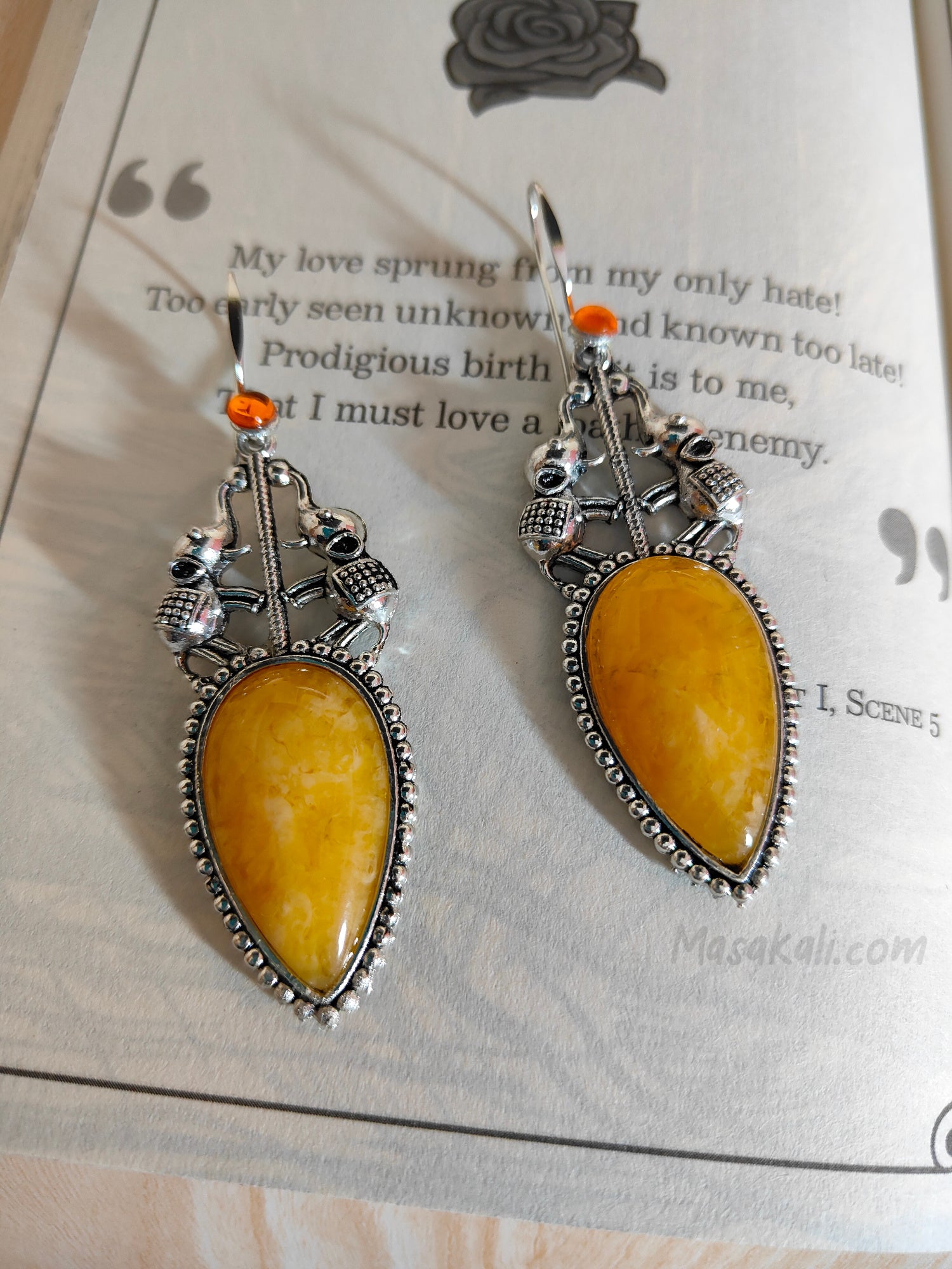 Drop-shaped Elephant Design Earrings Yellow Stone German Silver Dangler Jewellery