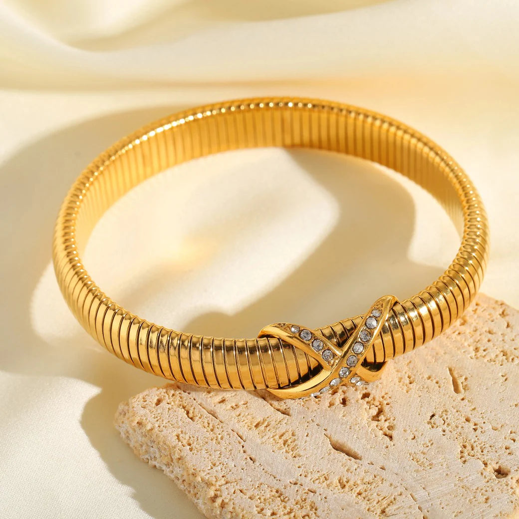 Gold-Plated Spring Bracelet American Diamond Knot Design Bangle