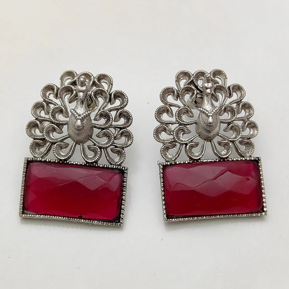 Silver-Plated Peacock Motif Ruby Stone Studded Earrings